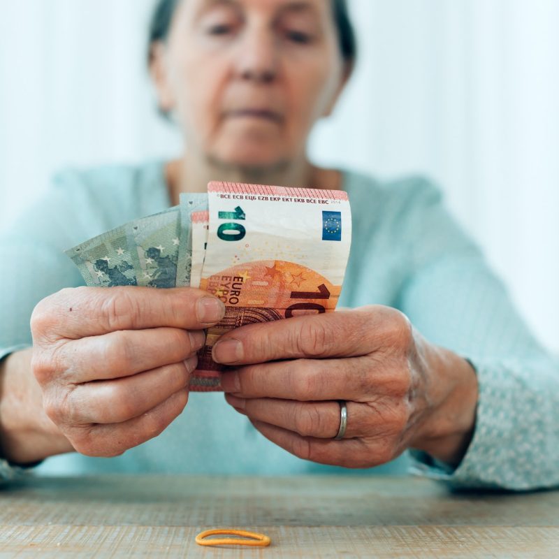 elderly-woman-counts-her-savings-person-with-money-in-hand-q65k91nleryglktpvktiak5i3tqz1rewh8bd36yyww