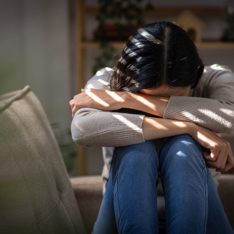 sad-or-heart-broken-asian-woman-or-asian-girl-sitting-on-a-sofa-in-the-living-room-anxiety-lonelin-q64mr1s6s31ekmlp1s2iodzw5jya62owc3p5ll4474